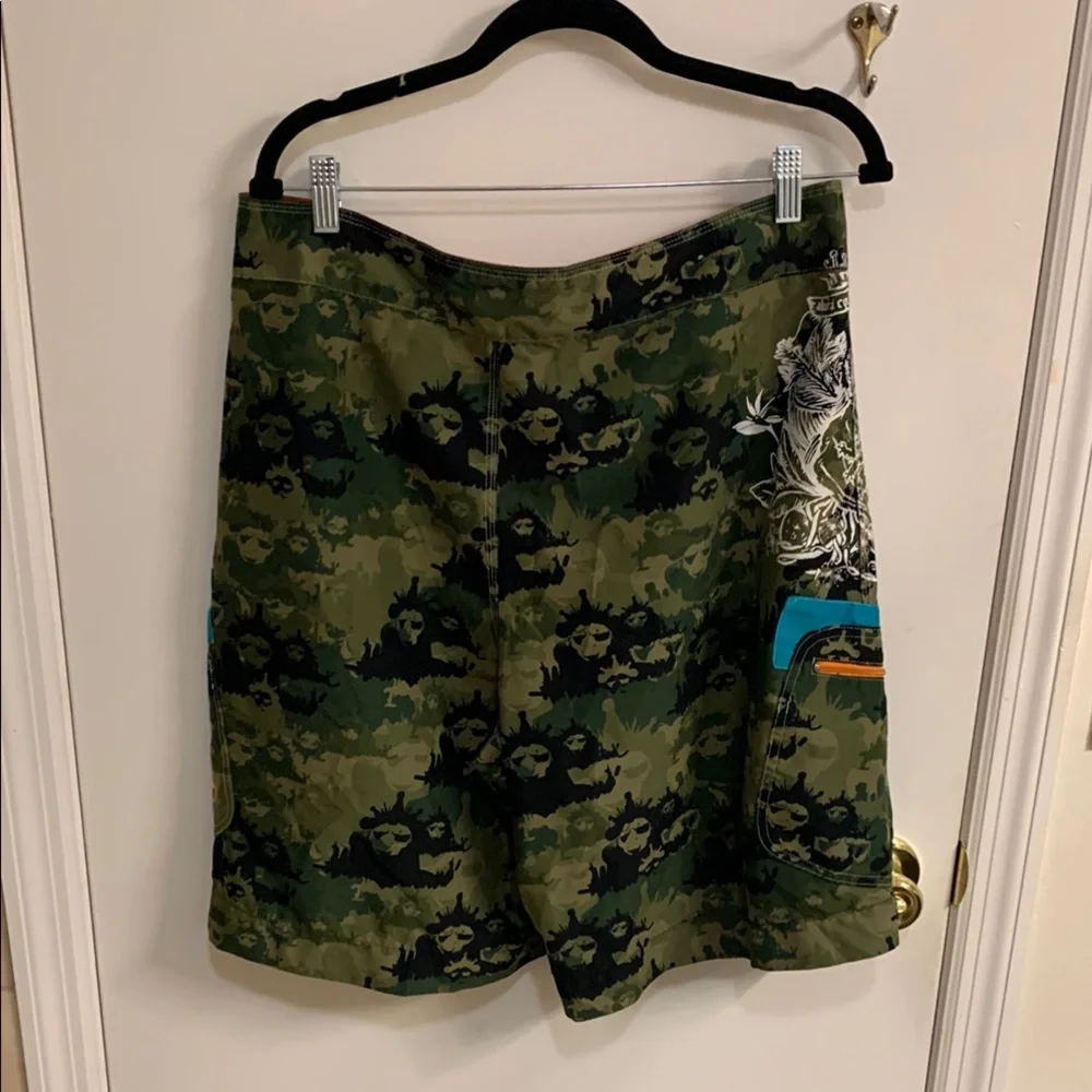 Live Mechanics Green/Blue Board Shorts with Drawstring Waist Camo Lion design.